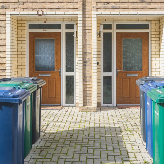 Recycling bins outside houses
